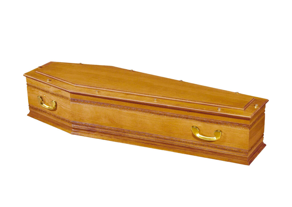 Cercueil en bois avec poignées dorées